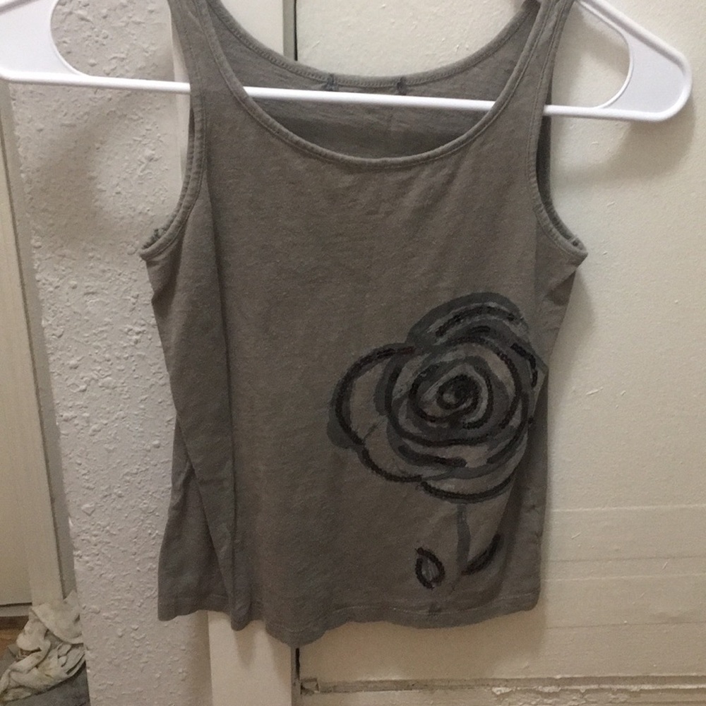 This is a grey tank top with a black and dark grey rose on it there is no tag